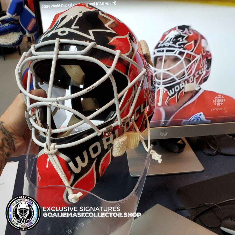 Martin Brodeur Game Worn Used Goalie Mask 2004 Gold Medal Team Canada World Cup Lefebvre CCM Shell + LOA From Brodeur Family + Photomatched + Signed & Inscribed AS-01481 - SOLD